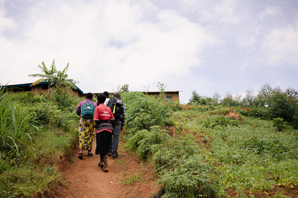 Long Miles Coffee Scouts walking up a coffee farm. 