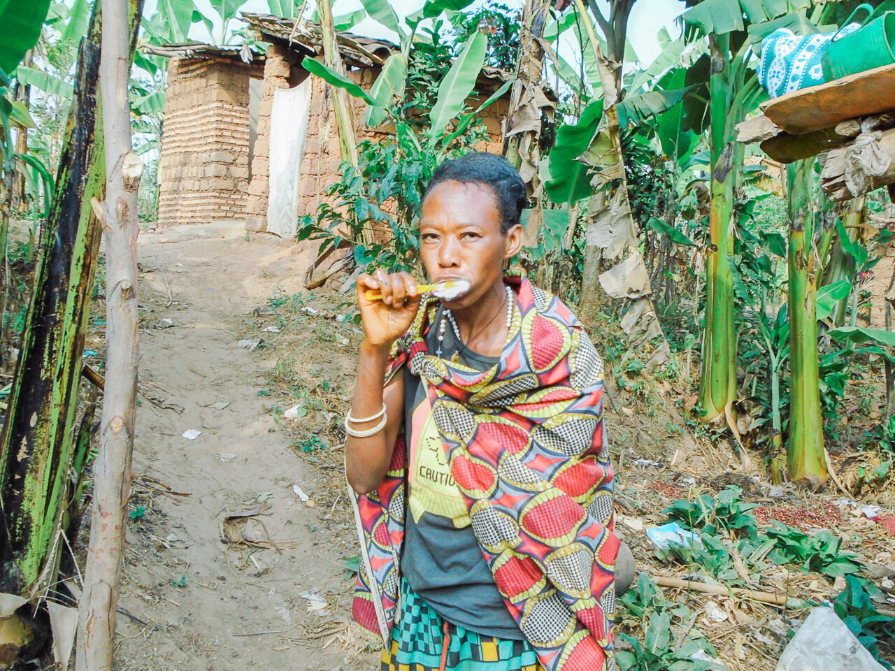 Dorothy, a Burundian coffee farmer, brushing her teeth